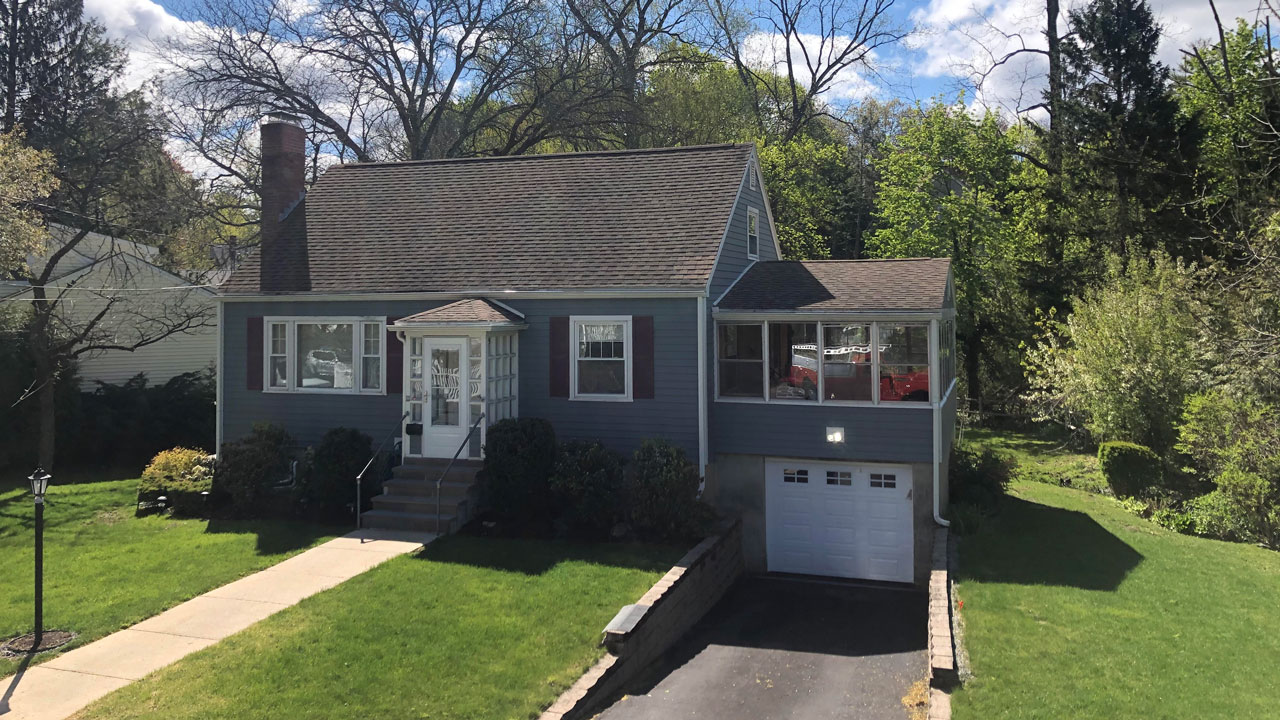 A roof replacement by Canoni Roofing in Waltham, Massachusetts