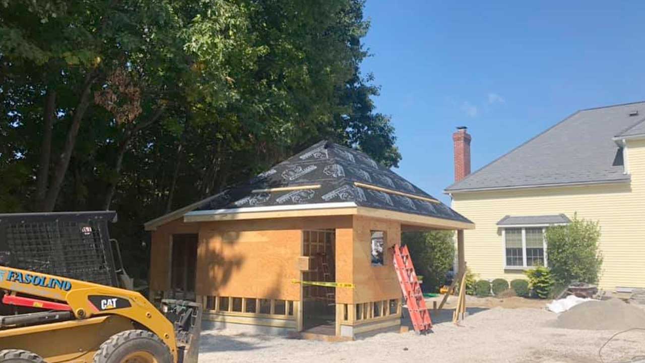 A new roof installed on a pool house by Canoni Roofing in Upton, Massachusetts